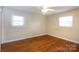 Spacious bedroom featuring hardwood floors, natural light, and ample closet space at 128 Summerlea Dr, Charlotte, NC 28214