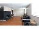 Spacious living room with fireplace and hardwood floors at 128 Summerlea Dr, Charlotte, NC 28214