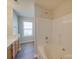 Bright bathroom with a soaking tub, modern fixtures, and a view into the bedroom at 13410 Tartarian Ct, Charlotte, NC 28215