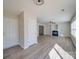 Hardwood floors, fireplace and open entryway with bright natural light coming in from a nearby window at 13410 Tartarian Ct, Charlotte, NC 28215