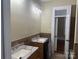 Bathroom features double vanities, mosaic tile accents, offering a spa-like experience at 135 Waycross Dr, Rockwell, NC 28138