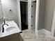 Bathroom with a double sink vanity and doorway to closet and toilet at 135 Waycross Dr, Rockwell, NC 28138