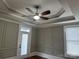 Bedroom showing the ceiling, with a fan and detailed trim, door to the outside, and window with blinds at 135 Waycross Dr, Rockwell, NC 28138
