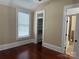 Bedroom features hardwood floors, neutral walls, bright window and a walk-in closet at 135 Waycross Dr, Rockwell, NC 28138