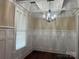 Bright dining room with elegant wainscoting, coffered ceilings and chandelier at 135 Waycross Dr, Rockwell, NC 28138