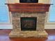 Stunning stone fireplace with a wood mantel as a focal point providing warmth and charm at 135 Waycross Dr, Rockwell, NC 28138