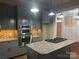 Modern kitchen with stainless steel appliances, granite countertops and gas cooktop at 135 Waycross Dr, Rockwell, NC 28138
