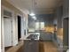 Updated kitchen featuring gas cooktop, granite counters, and stainless appliances at 135 Waycross Dr, Rockwell, NC 28138