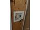 Laundry hookups with red and blue water valves set in a framed cutout at 135 Waycross Dr, Rockwell, NC 28138