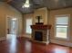 Spacious living room with fireplace, hardwood floors, and bright windows at 135 Waycross Dr, Rockwell, NC 28138
