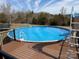 Above ground pool with a slide and deck with ample room for outdoor entertaining at 135 Waycross Dr, Rockwell, NC 28138