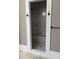 Walk-in shower with light gray marble style tile and a built-in bench at 135 Waycross Dr, Rockwell, NC 28138
