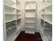 Walk-in closet with white shelves and metal storage baskets at 135 Waycross Dr, Rockwell, NC 28138