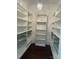 Walk-in closet with shelves and hanging metal baskets at 135 Waycross Dr, Rockwell, NC 28138