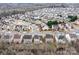 Expansive aerial view of a residential community featuring neatly arranged homes with canopy 2025, surrounded by trees at 14104 Green Birch Dr, Pineville, NC 28134