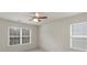 Bedroom featuring neutral carpet and two windows at 14104 Green Birch Dr, Pineville, NC 28134