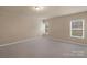 Bedroom featuring neutral walls and carpet, and two bright windows at 14104 Green Birch Dr, Pineville, NC 28134