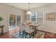Cozy dining area with sliding door access to outdoor deck at 14104 Green Birch Dr, Pineville, NC 28134