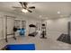 Finished exercise room with fitness equipment and sliding glass doors at 14104 Green Birch Dr, Pineville, NC 28134