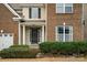 Welcoming front porch with white columns and a cozy entrance surrounded by well-maintained landscaping at 14104 Green Birch Dr, Pineville, NC 28134