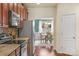 Modern kitchen featuring granite counters, stainless steel appliances, and hardwood floors, adjacent to the dining area at 14104 Green Birch Dr, Pineville, NC 28134