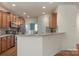 Spacious kitchen with breakfast bar, stainless steel appliances, and ample cabinet space at 14104 Green Birch Dr, Pineville, NC 28134