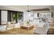 Airy living room with a view of a modern outdoor patio, wood floors and minimalist decor at 1437 Samuel Spencer Pkwy, Davidson, NC 28036
