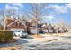 Street view of beautiful brick townhouses featuring two-car garages and well-maintained landscaping at 15562 Canmore St, Charlotte, NC 28277