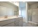 Elegant bathroom with double sinks, soaking tub, and shower at 166 Swann Rd # 5, Statesville, NC 28625
