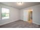 Well-lit bedroom with large window and access to bathroom at 166 Swann Rd # 5, Statesville, NC 28625