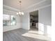 Open concept dining room with kitchen view and hardwood floors at 166 Swann Rd # 5, Statesville, NC 28625