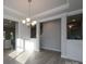 Bright dining room features hardwood floors and a chandelier at 166 Swann Rd # 5, Statesville, NC 28625
