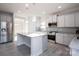 Modern kitchen with white cabinets, granite countertops, and island at 166 Swann Rd # 5, Statesville, NC 28625