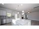 Modern kitchen with large island, granite countertops, and stainless steel appliances at 166 Swann Rd # 5, Statesville, NC 28625