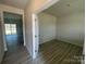 Office space featuring a door with glass panes and light-colored walls with wood-look floors at 214 Brinkley Dr, Kings Mountain, NC 28086