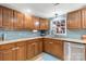 This is a cozy kitchen, with a window overlooking a small yard, and stainless steel appliances at 2227 Kenwood Dr, Kannapolis, NC 28081