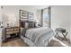 Cozy bedroom with a striped comforter and wood nightstand at 2320 Donnelly Hills Ln, Charlotte, NC 28262