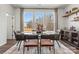Bright dining area with glass table and modern chairs, overlooking wooded area at 2320 Donnelly Hills Ln, Charlotte, NC 28262