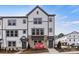 Modern three-story townhome with gray and white siding at 2320 Donnelly Hills Ln, Charlotte, NC 28262