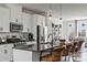 Modern kitchen featuring white cabinets and a large island at 2320 Donnelly Hills Ln, Charlotte, NC 28262