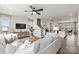 Open living room with sectional sofa and views into kitchen and dining areas at 2320 Donnelly Hills Ln, Charlotte, NC 28262