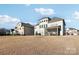 Exterior view of home and backyard with screened in patio at 4027 Wiltshire Ln, Indian Land, SC 29707