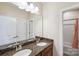 Bathroom with double sinks, granite countertop, and view of tub/shower area at 4027 Wiltshire Ln, Indian Land, SC 29707
