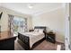 Bedroom with neutral walls, carpet, and black furniture, including bed and two nightstands at 4027 Wiltshire Ln, Indian Land, SC 29707