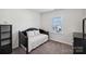 Cozy bedroom with a window, carpet, and minimalist furnishings at 4027 Wiltshire Ln, Indian Land, SC 29707