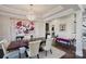 Formal dining room featuring a chandelier, a decorative wall mural, and elegant furnishings at 4027 Wiltshire Ln, Fort Mill, SC 29707