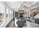 Inviting living room with a stone fireplace, coffered ceilings, and ample natural light at 4027 Wiltshire Ln, Indian Land, SC 29707