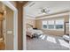 Sun-filled main bedroom with a tray ceiling and a view of the neighborhood from multiple windows at 4027 Wiltshire Ln, Indian Land, SC 29707