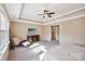 Bright main bedroom showcasing a tray ceiling, accent chair, and dresser at 4027 Wiltshire Ln, Indian Land, SC 29707