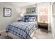 Cozy bedroom with plaid bedding and stylish decor at 437 Serenity Cir # E, Cramerton, NC 28032